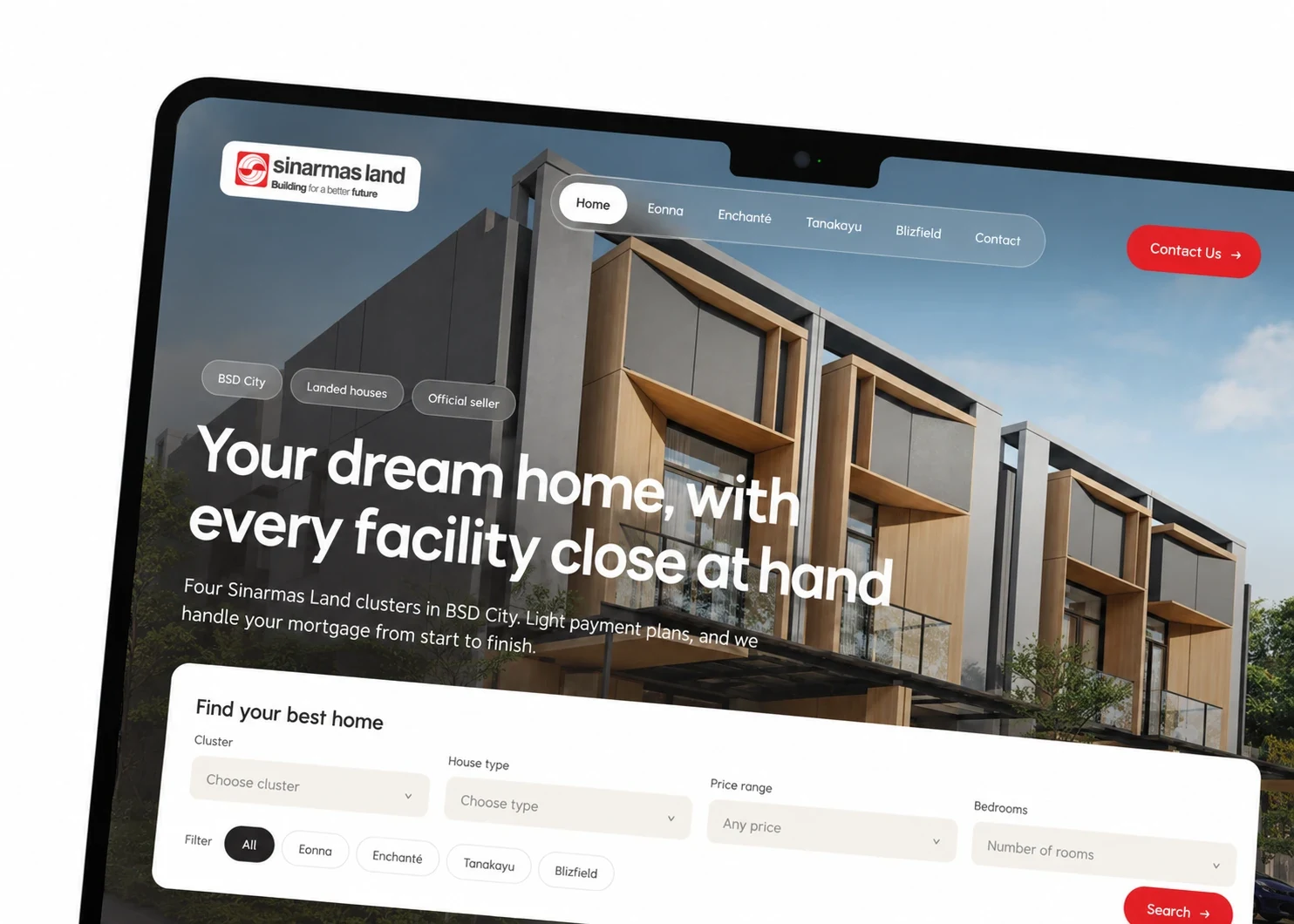 A close-up of a laptop showing the home hero: “Your dream home, with every facility close at hand” and the search card